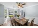 This dining room has wainscoting, a bay window, and an elegant chandelier at 2360 Brookgreen Commons, Kennesaw, GA 30144
