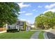 Attractive two-story house featuring well-maintained landscaping, gray siding, and a curved driveway at 2360 Brookgreen Commons, Kennesaw, GA 30144