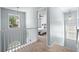 A bright hallway showcases a cozy bedroom with lots of natural light from the windows at 2360 Brookgreen Commons, Kennesaw, GA 30144