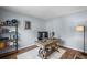 This home office includes a modern desk, wood flooring, and decorative shelving at 2360 Brookgreen Commons, Kennesaw, GA 30144