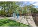 A fun splash pad area with a palm tree water feature and lounge chairs for relaxing nearby at 2360 Brookgreen Commons, Kennesaw, GA 30144