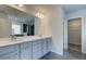 Elegant bathroom with double sinks, a large mirror, and access to a separate shower area at 537 Teversham Dr, Mcdonough, GA 30253