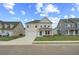 Charming two-story home with manicured lawn, attached garage, and welcoming blue front door at 537 Teversham Dr, Mcdonough, GA 30253