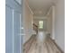 Inviting foyer featuring wood-look floors, stylish trim, and a staircase to the upper level at 537 Teversham Dr, Mcdonough, GA 30253