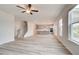 Open-concept space connecting the living room to the kitchen, featuring wood floors and modern finishes at 537 Teversham Dr, Mcdonough, GA 30253