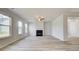Spacious living room with a fireplace, many windows and neutral colored walls at 537 Teversham Dr, Mcdonough, GA 30253