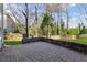 A brick patio provides an entertainment area leading out into a grassy backyard with privacy fence at 5635 Charleston Bay Dr, Cumming, GA 30041