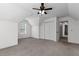 Bright bedroom featuring neutral carpet, ceiling fan and a closet at 5635 Charleston Bay Dr, Cumming, GA 30041