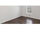 Cozy room featuring hardwood floors and a large window at 5635 Charleston Bay Dr, Cumming, GA 30041