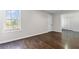 Bedroom showcasing hardwood floors and large window views at 5635 Charleston Bay Dr, Cumming, GA 30041