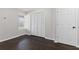 Bedroom showcasing hardwood floors, a window and double closets at 5635 Charleston Bay Dr, Cumming, GA 30041
