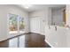 Dining area with hardwood floors, patio access, breakfast bar, and pantry at 5635 Charleston Bay Dr, Cumming, GA 30041