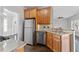 Modern kitchen with stainless steel appliances, granite countertops, and breakfast bar seating at 5635 Charleston Bay Dr, Cumming, GA 30041