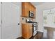 Kitchen featuring stainless steel range, granite countertops, and ample storage space at 5635 Charleston Bay Dr, Cumming, GA 30041