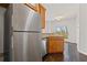 Kitchen featuring stainless steel refrigerator, granite counters, and access to the deck at 5635 Charleston Bay Dr, Cumming, GA 30041