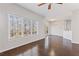 Bright living room with large window, hardwood floors, and patio access at 5635 Charleston Bay Dr, Cumming, GA 30041