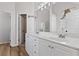 Main bathroom featuring double vanity, walk-in closet, and modern fixtures at 5635 Charleston Bay Dr, Cumming, GA 30041