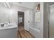 Bright main bathroom with a soaking tub, dual vanity, and plenty of natural light at 5635 Charleston Bay Dr, Cumming, GA 30041