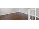 Empty office or study with hardwood floors and a glass paneled door at 5635 Charleston Bay Dr, Cumming, GA 30041