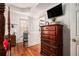 Bedroom features a tall dresser and en suite bathroom at 180 Sable Cir, Covington, GA 30016