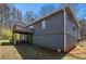 Side view of home showing walk out basement and a deck on the 1st floor at 180 Sable Cir, Covington, GA 30016