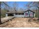 Charming ranch home features an open carport, a front porch and a spacious yard at 180 Sable Cir, Covington, GA 30016