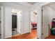 A hallway with access to a bathroom and a bedroom at 180 Sable Cir, Covington, GA 30016