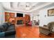 Open floor plan featuring hardwood floors, a fireplace, and an eat in kitchen at 180 Sable Cir, Covington, GA 30016