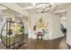 Open foyer with hardwood floors, elegant lighting, and architectural details at 224 Osier Dr, Mcdonough, GA 30252