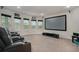 Enjoy movie nights in this home theater with plush seating and large projector screen at 224 Osier Dr, Mcdonough, GA 30252