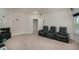 Comfortable home theater room with tiered seating and entertainment console at 224 Osier Dr, Mcdonough, GA 30252