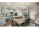 Open concept kitchen with stainless steel appliances, pantry, large island and ample storage at 224 Osier Dr, Mcdonough, GA 30252