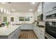 Bright kitchen featuring stainless steel appliances, granite countertops, and center island at 224 Osier Dr, Mcdonough, GA 30252