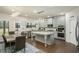 Modern kitchen with stainless steel appliances, granite countertops, island and hardwood floors at 224 Osier Dr, Mcdonough, GA 30252