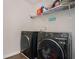 Modern laundry room showcasing a front-load washer and dryer set at 224 Osier Dr, Mcdonough, GA 30252
