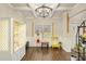 Bright living room area with hardwood flooring, coffered ceilings, and white trim at 224 Osier Dr, Mcdonough, GA 30252