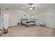 Bright main bedroom featuring vaulted ceilings, ceiling fan, and an ensuite bathroom at 224 Osier Dr, Mcdonough, GA 30252