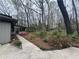 This home features a maturely landscaped backyard with colorful azaleas and ample tree coverage at 257 Forest Lake Rd, Lawrenceville, GA 30046