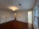 Bedroom features hardwood floors, closet, and attached bathroom with a tub/shower combination at 257 Forest Lake Rd, Lawrenceville, GA 30046