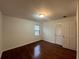 This bedroom boasts hardwood floors, a window for natural light and a closet for storage at 257 Forest Lake Rd, Lawrenceville, GA 30046