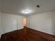 Bedroom features hardwood floors, closet space, and a door leading to another room at 257 Forest Lake Rd, Lawrenceville, GA 30046