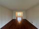 Spacious living room features gleaming hardwood floors and neutral paint, creating a bright atmosphere at 257 Forest Lake Rd, Lawrenceville, GA 30046