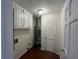 Functional utility room with ample storage space and essential appliances, plus door at 257 Forest Lake Rd, Lawrenceville, GA 30046