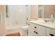 A clean, classic bathroom with a tub and shower combination and white vanity at 4236 Providence Ln, Tucker, GA 30084