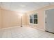 Tiled bedroom features a large window, allowing plenty of natural light at 4236 Providence Ln, Tucker, GA 30084