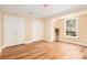 Bedroom with laminate floors, a view to the outside, and double closets at 4236 Providence Ln, Tucker, GA 30084