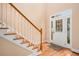Bright entryway features hardwood floors, staircase, and sidelights around the front door at 4236 Providence Ln, Tucker, GA 30084