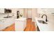 Contemporary kitchen with white cabinets, quartz countertops, stainless steel appliances, and a practical island at 4236 Providence Ln, Tucker, GA 30084
