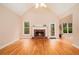 Inviting living room showcasing hardwood floors, a brick fireplace, and ample natural light at 4236 Providence Ln, Tucker, GA 30084