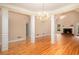 Spacious living room boasts hardwood floors, decorative columns, and a cozy fireplace at 4236 Providence Ln, Tucker, GA 30084